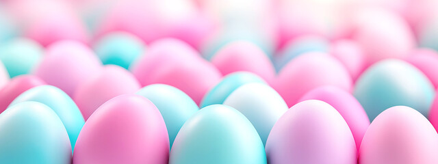 Vibrant pastel easter blue and pink eggs displayed in soft focus for spring celebration. banner