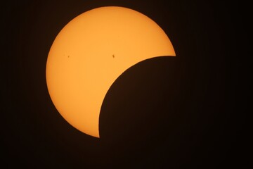 Partial Solar Eclipse with Visible Sunspots