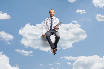 Male doctor smiling and sitting on a cloud