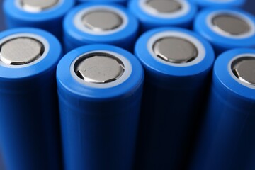 Many AA cell batteries as background, closeup