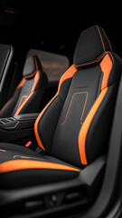 Luxury automotive interior showcasing black and orange sports seats with sleek design details