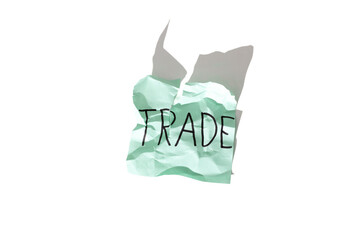 Word "trade" on a crumpled paper