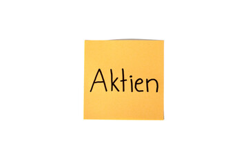 German word "Aktien" on a orange paper