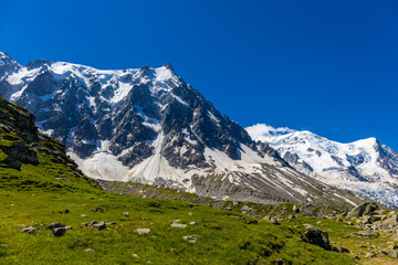 Aiguille du Midi peak in the Alps. Chamonix valley landscape of a prominent rocky towering mountain peak in french Alps. Chamonix-Montblanc area beautiful landscape of Aiguille du Midi summit