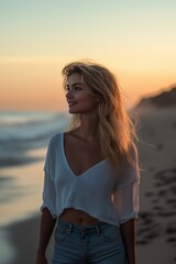 A beautiful young woman enjoys a serene beach sunset, embodying tranquility and joy in nature's embrace.