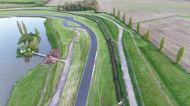 Drone shot of Mallory Park Racing Circuit with a lake and green friends