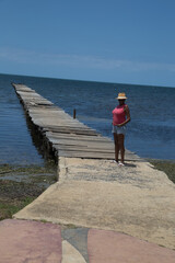 Black Woman on Pier in Puerto Esperanza, Cuba