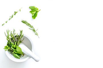 Homeopathy with leaves and healing herbs for making oil on white