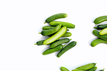 Mini cucumbers on white background.