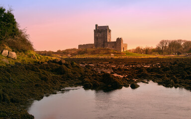 Fototapeta premium Beautiful sunrise coastal landscape scenery of Dunguaire castle at Kinvara bay, Galway, Ireland