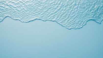 Top view of clear water with rippled surface on a light blue backdrop with copy space image.