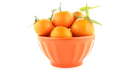 Tangerines on ceramic orange bowl