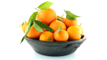 Tangerines on clay bowl