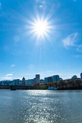 Sun shining Over Portland, Oregon Riverfront Park and Skyline