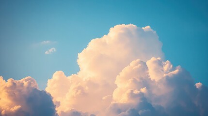 Soft White Clouds Against a Vibrant Blue Sky at Sunset with Gentle Light Filtering Through, Creating a Dreamy and Serene Atmosphere Perfect for Scenic Views