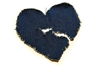 torn heart made of blue denim.

