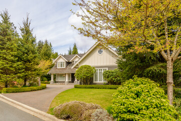 Two story luxury house with beautiful summer  landscape in Vancouver, Canada, North America. Day time on June 2024.
