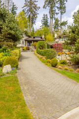 Two story luxury house with beautiful summer  landscape in Vancouver, Canada, North America. Day time on June 2024.
