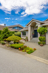 Two story luxury house with beautiful summer  landscape in Vancouver, Canada, North America. Day...