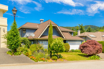 Two story luxury house with beautiful summer  landscape in Vancouver, Canada, North America. Day...