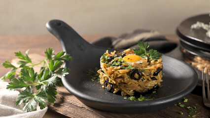 Bacalhau à Brás, a traditional Portuguese dish featuring shredded codfish, scrambled eggs,...