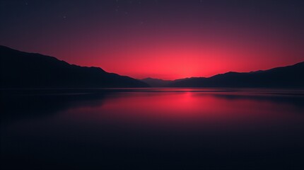 Fototapeta premium Dramatic mountain landscape at sunset with vibrant red sky reflection on calm lake