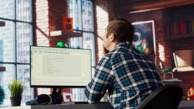 Software developer at computer waiting for code to finish compiling, yawning, feeling bored. Impatient man tired to wait for algorithms building scripts to finish, camera B