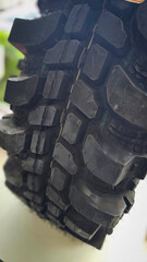 detailed image of a brand new car tire showcasing its intricate tread pattern for enhanced grip and performance