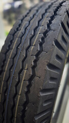 detailed image of a brand new car tire showcasing its intricate tread pattern for enhanced grip and performance