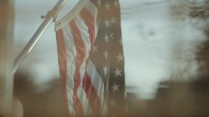 View of American flag on a house from inside 