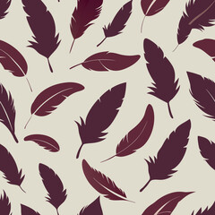 Fototapeta premium Feathers of various sizes scattered across a light background create a visually captivating pattern