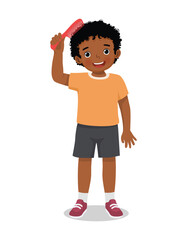 Cute little African boy combing her hair with comb