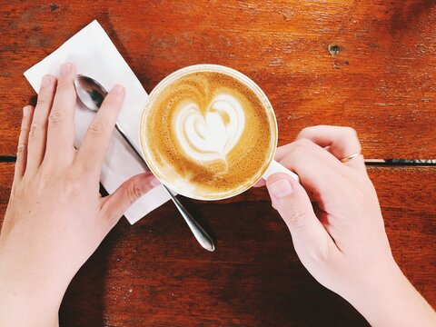 person holding a cup of coffee