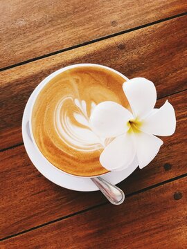 cup of coffee on wooden table