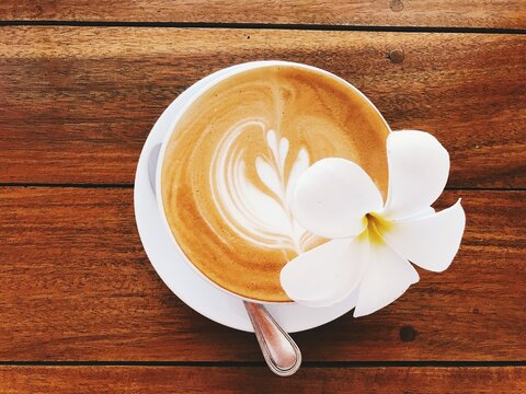 cup of coffee on wooden table
