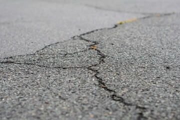 Crack in grey concrete surface