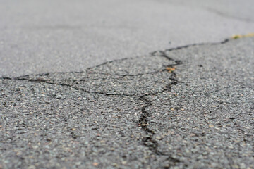 Crack in grey concrete surface