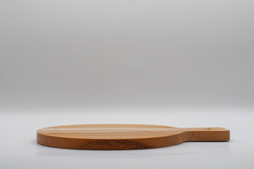 wooden cutting board on gray background