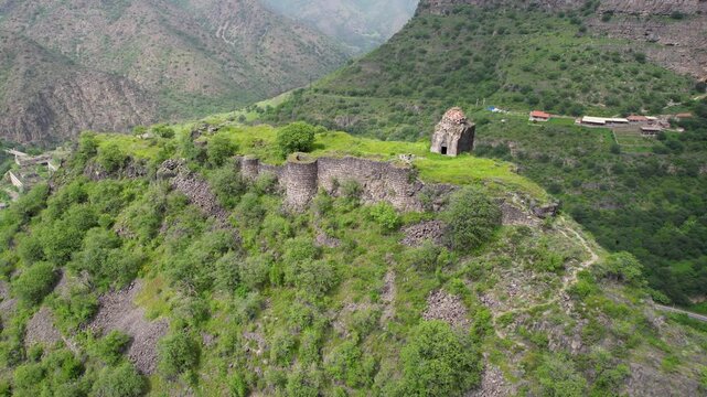 Orbital aerial shot of Kayan Fortress on sunny spring day. Haghpat, Armenia.