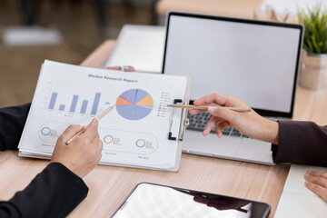 Business financing accounting banking concept. Two asian Business doing finances and calculate on desk about cost at workplace. Business working on desk with using calculator, finance accounting.
