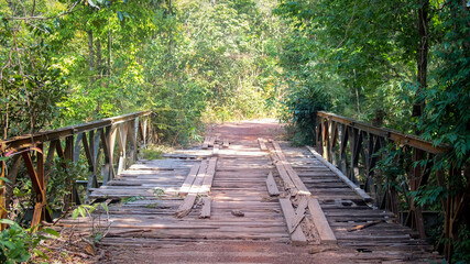 Old wooden with steel bridge broken use for cross over stream river at countryside at Vientiane,...