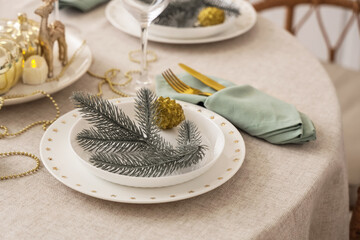 Festive table setting with Christmas branches. Closeup