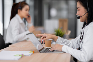 Asian call center team, customer service, telesales wearing headset or headphone talking with customer in the office. Customer Service Representative, Service, Call Center, 