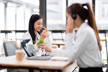 Asian call center team, customer service, telesales wearing headset or headphone talking with customer in the office. Customer Service Representative, Service, Call Center, 