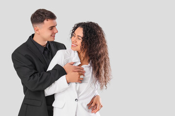 Young couple hugging on white background. Yin Yang concept