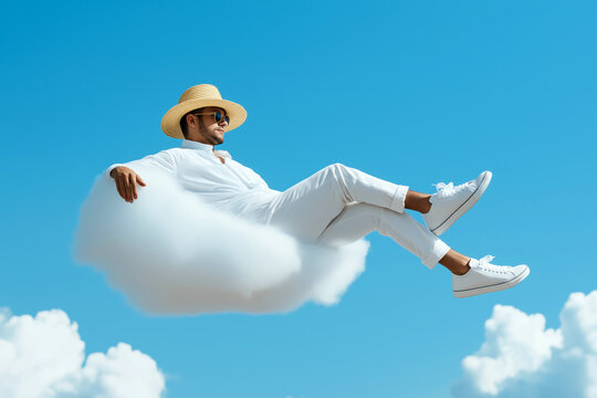 Stylish man in white outfit relaxing on a floating cloud against a blue sky