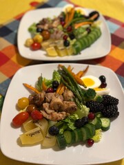 Fresh vegetable salad with a vibrant mix of greens, cherry tomatoes, cucumbers, and bell peppers. Crisp, colorful, and packed with vitamins, this salad makes a healthy, delicious meal or side.
