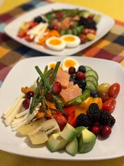 Fresh vegetable salad with a vibrant mix of greens, cherry tomatoes, cucumbers, and bell peppers. Crisp, colorful, and packed with vitamins, this salad makes a healthy, delicious meal or side.
