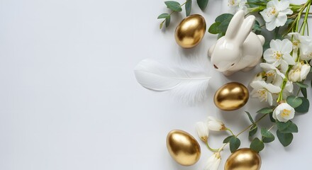 Easter table decorations. Happy Easter concept with golden easter eggs, feathers, ceramic bunny and spring flowers. Easter background with copy space. Flat lay