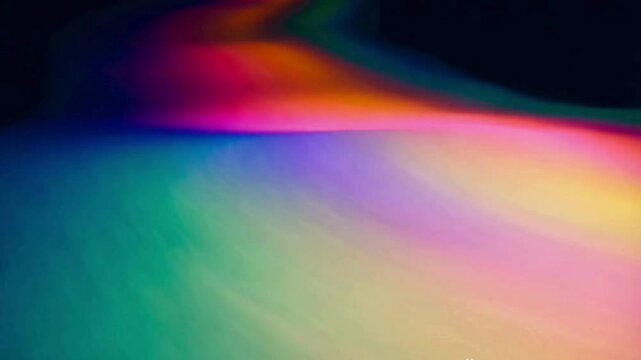 abstract clowing background with multicolored blurred gradients moving on dark
